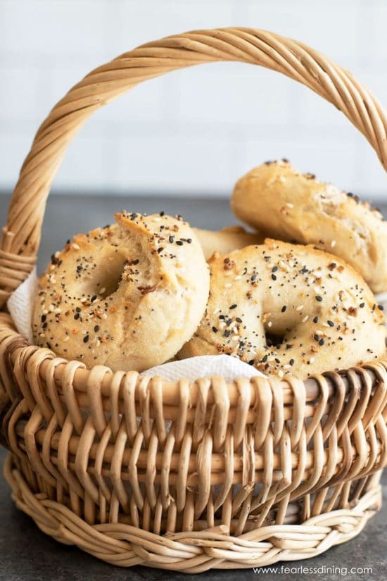 a wicker basket full of gluten free bagels