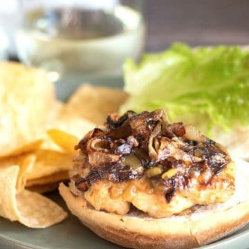 A cooked ground turkey burger on a gluten free bun.