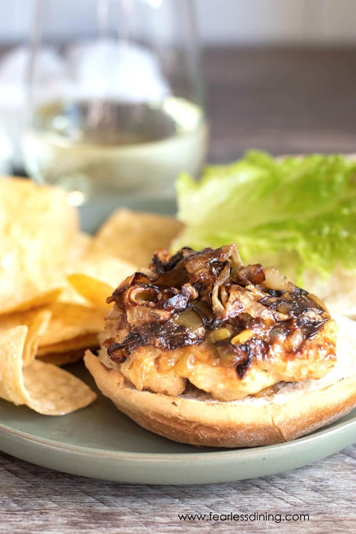 A cooked ground turkey burger on a gluten free bun.