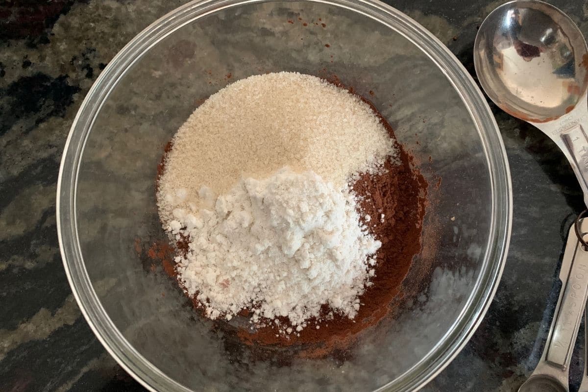 The mug brownie dry ingredients in a glass bowl.