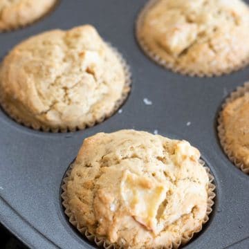 Baked gluten free apple muffins in a tin.