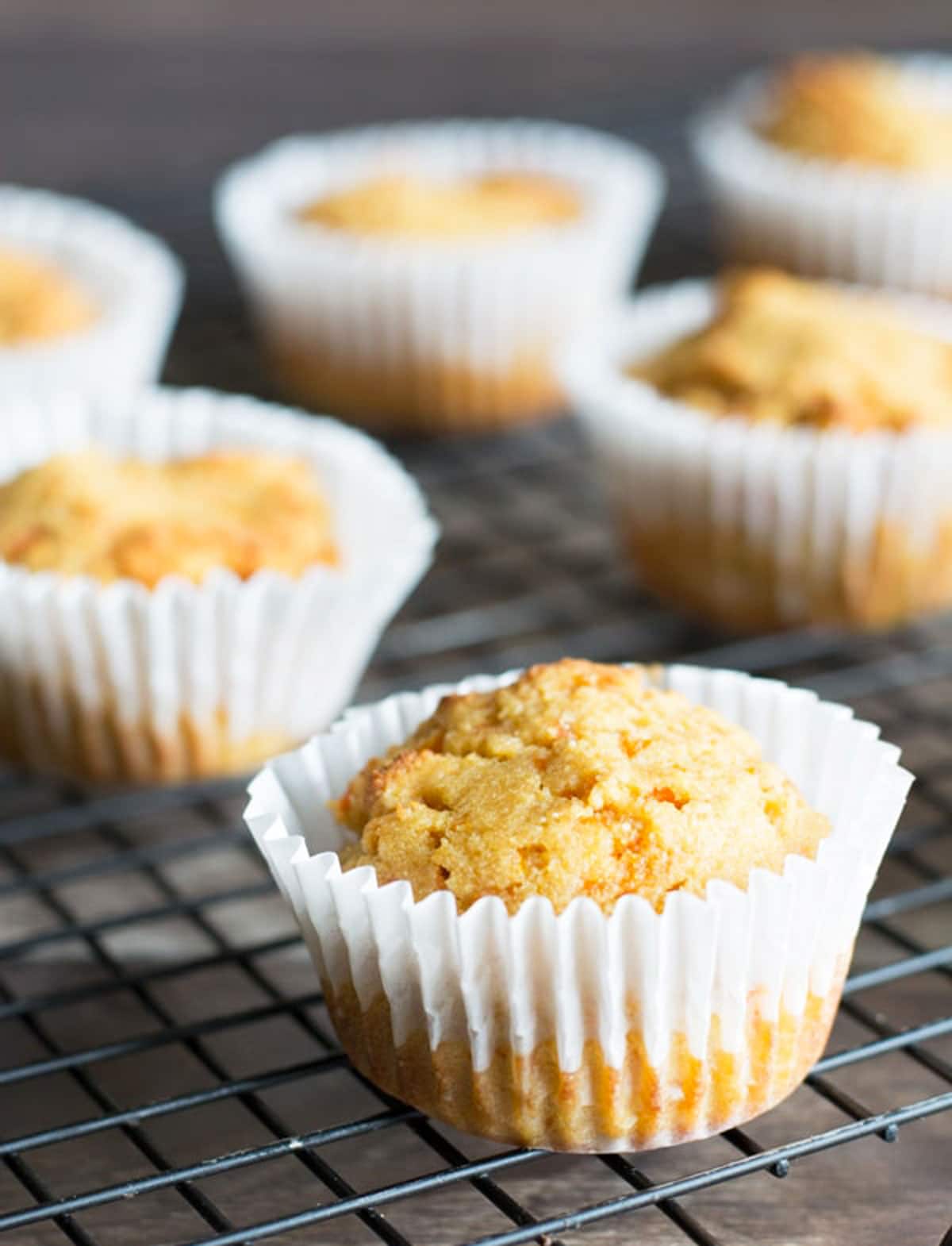gluten free carrot muffins on a cooling rack