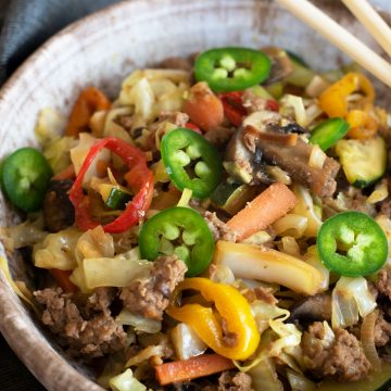 A close up of the egg roll in a bowl.