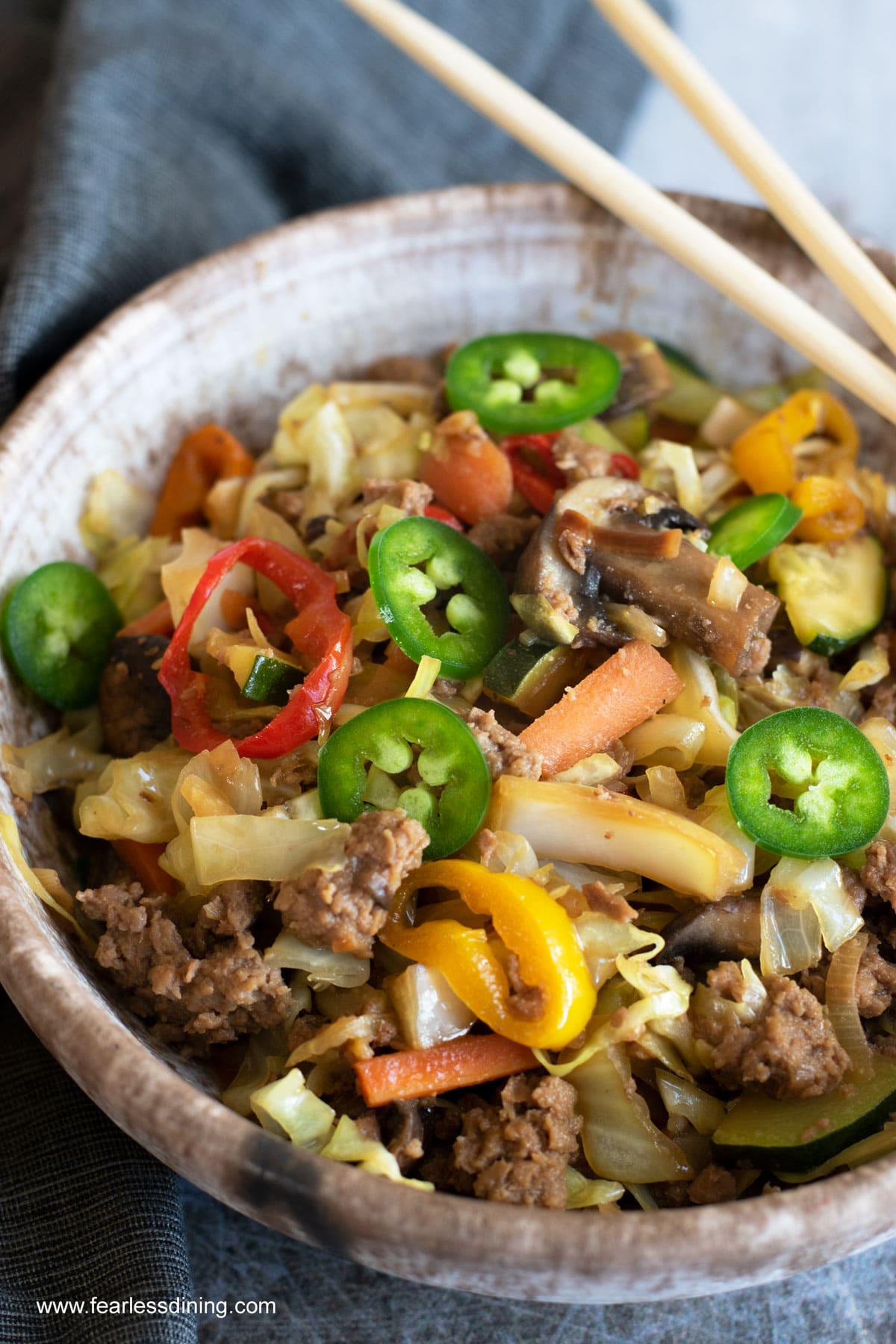 A close up of the egg roll in a bowl.