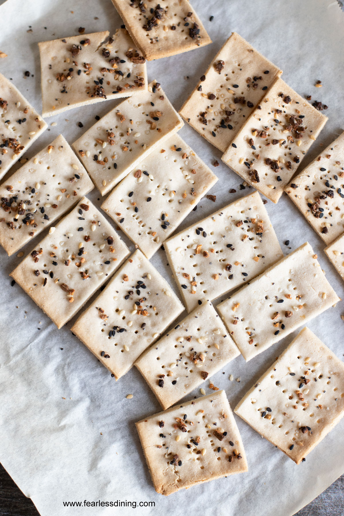 Baked gluten free matzo crackers on a baking sheet.