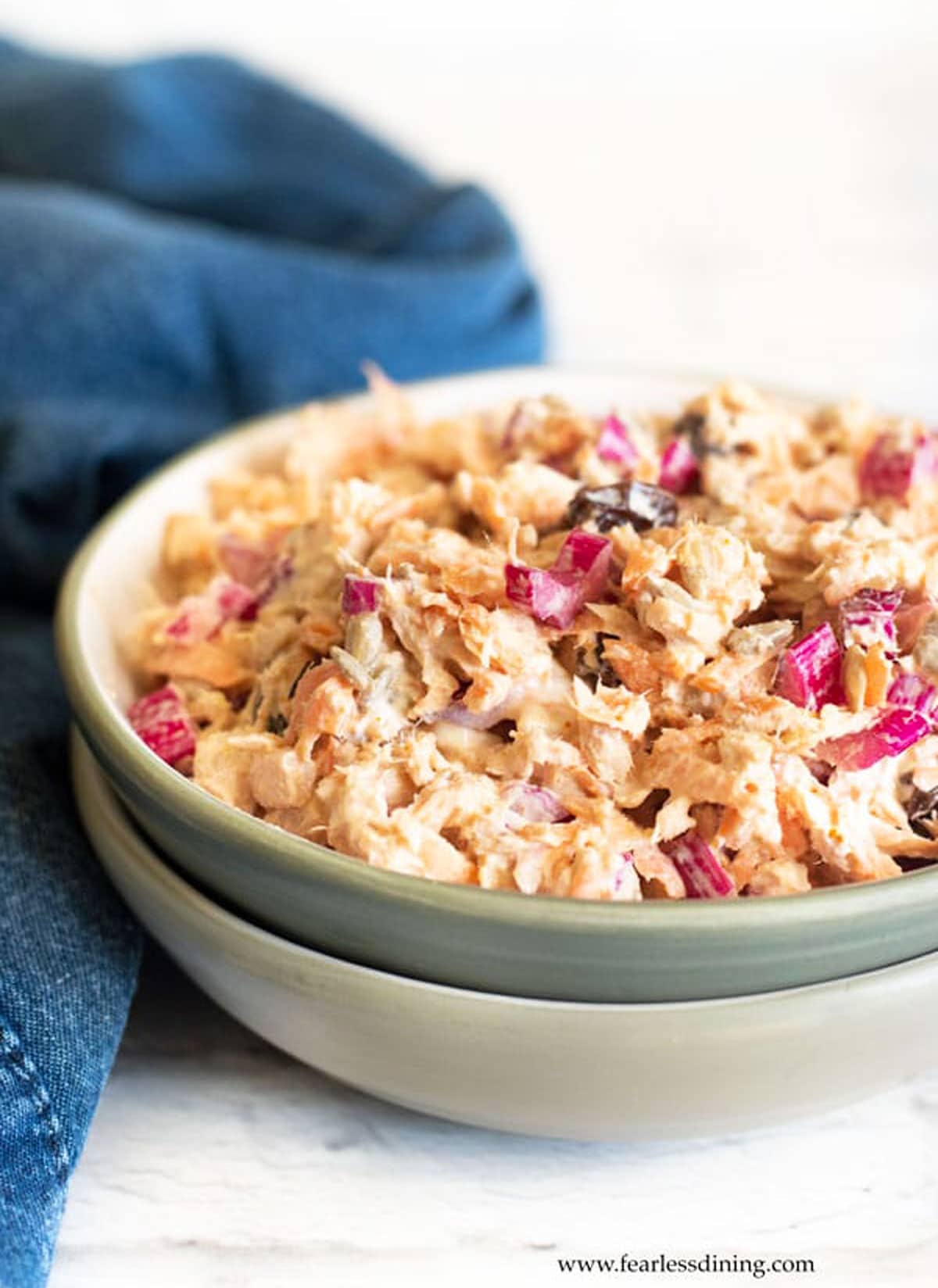 A bowl full of curried tuna salad.