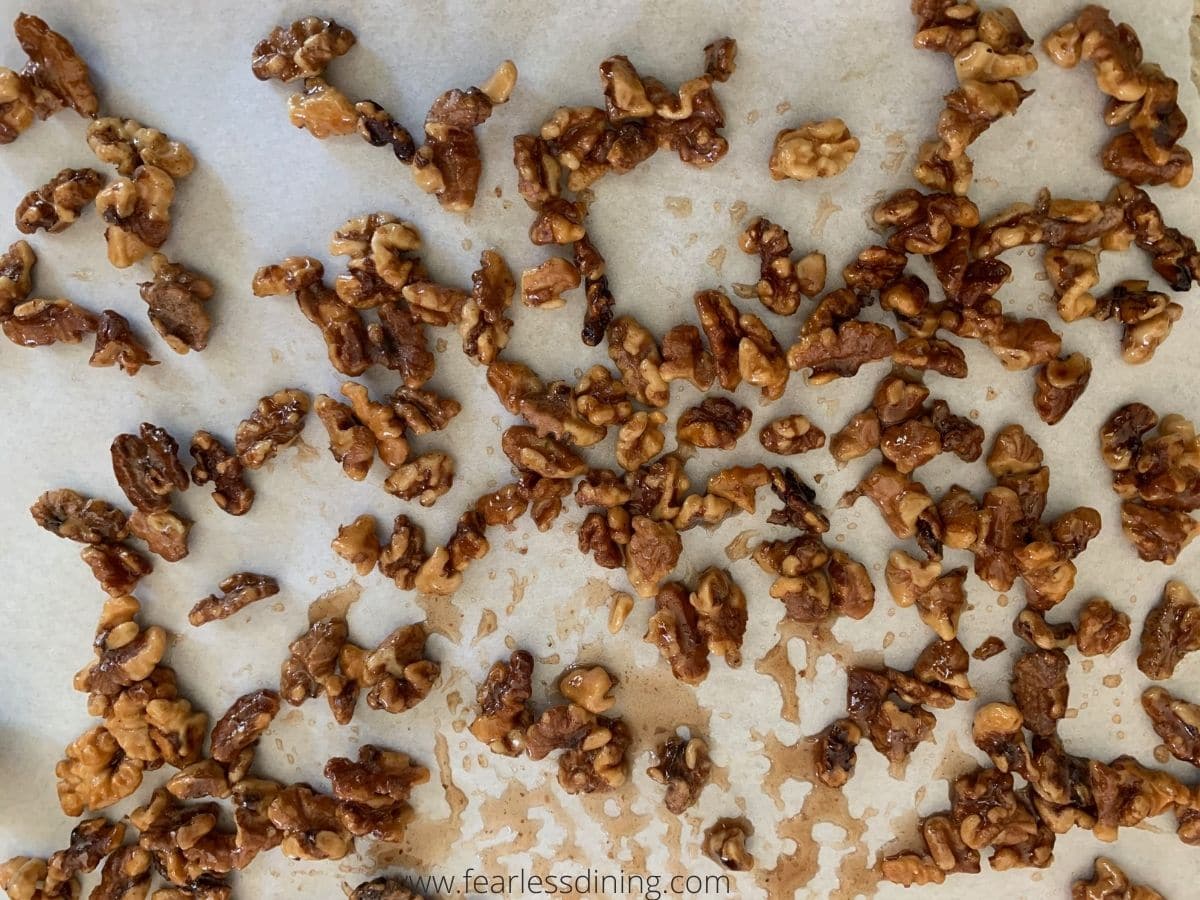 Candied walnuts on parchment paper.