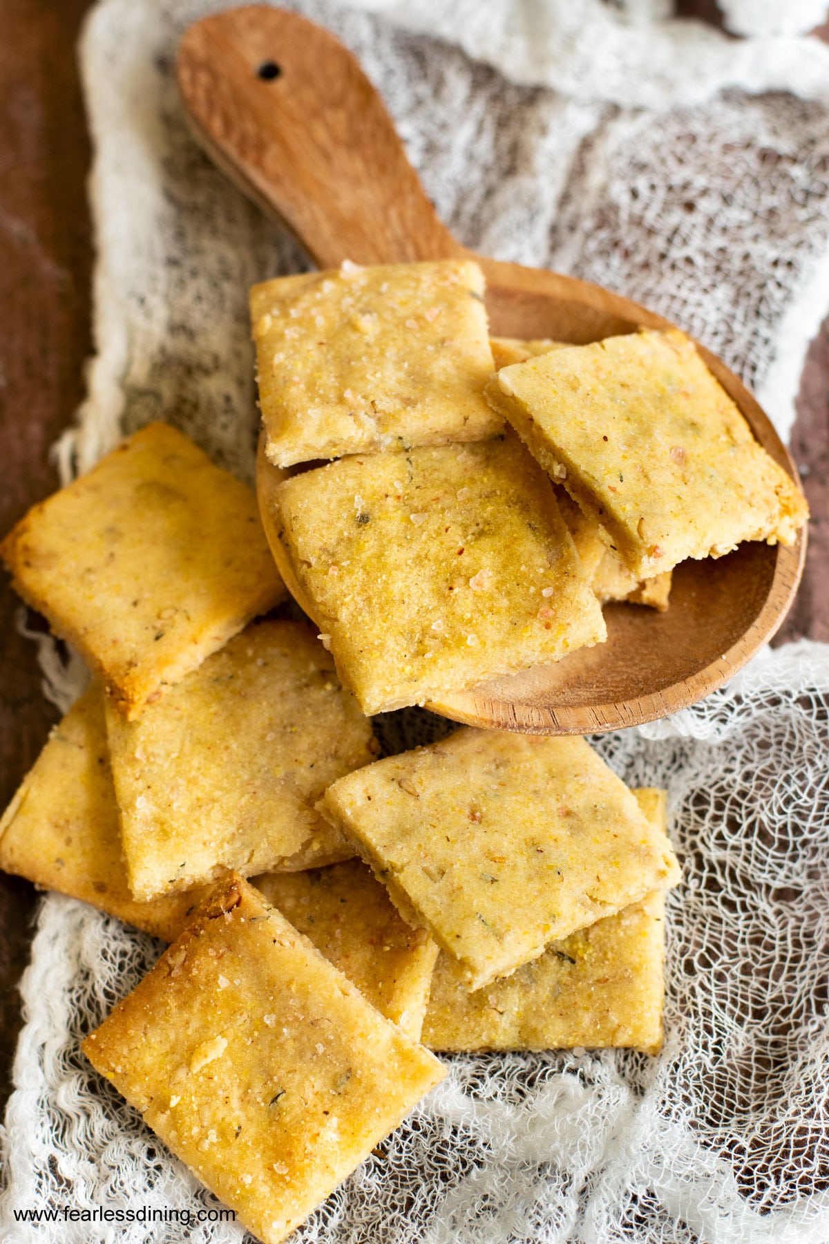 Gluten free sourdough discard crackers on a cutting board.