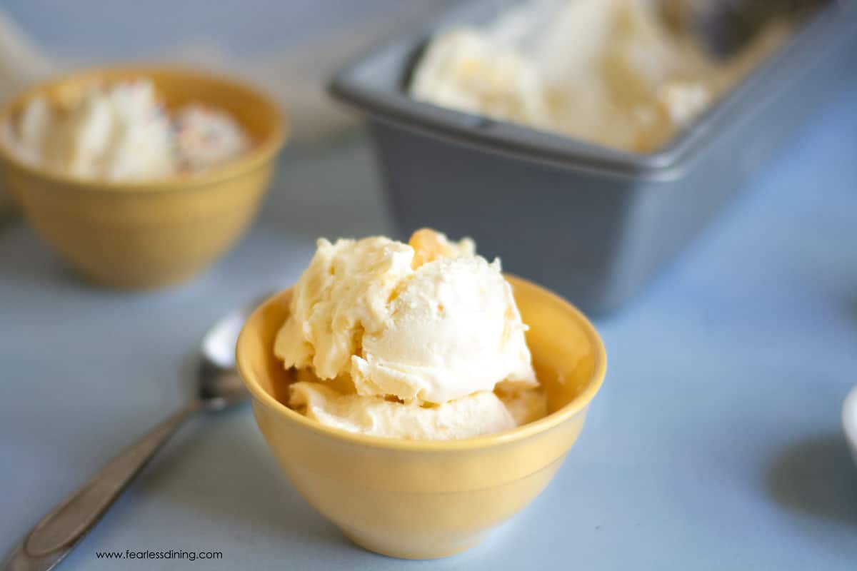 two yellow bowls filled with lemon ice cream