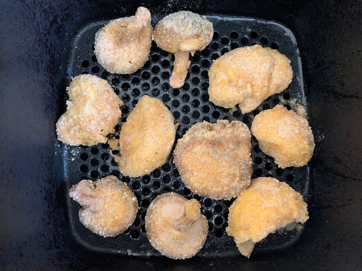 Breaded mushrooms ready to air fry.