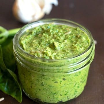 A small mason jar filled with nut free pesto.