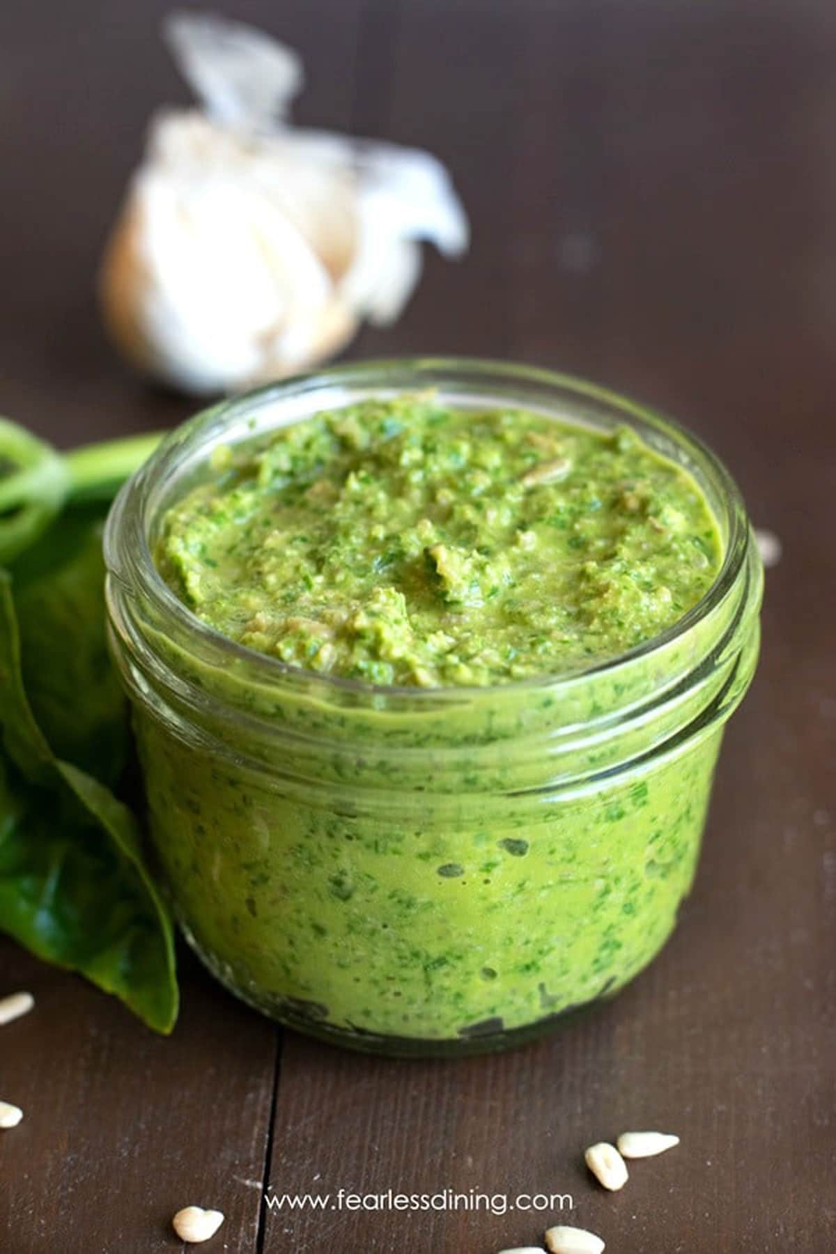 A small mason jar filled with nut free pesto.