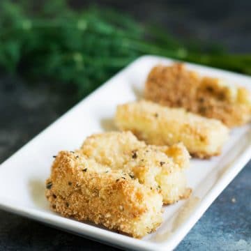 a rectangle plate with fried cheese sticks