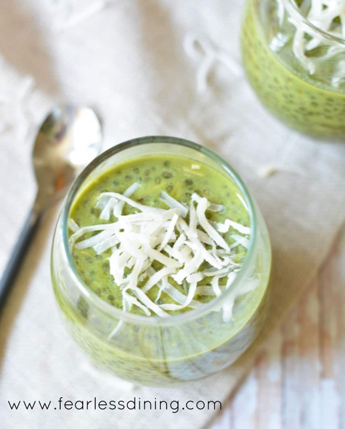 The top view of a glass filled with matcha chia pudding.