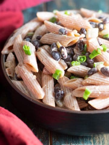a bowl full of red lentil pasta salad