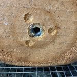 The bottom of the loaf with the bread machine paddle.