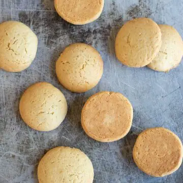 a cookie sheet with baked gluten free vanilla wafer cookies