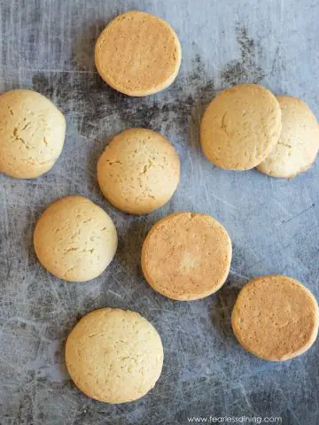 a cookie sheet with baked gluten free vanilla wafer cookies