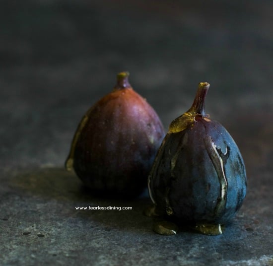 Raw figs with honey drizzled on top.