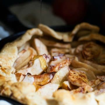 A photo of drizzling honey over the gluten free apple galette.
