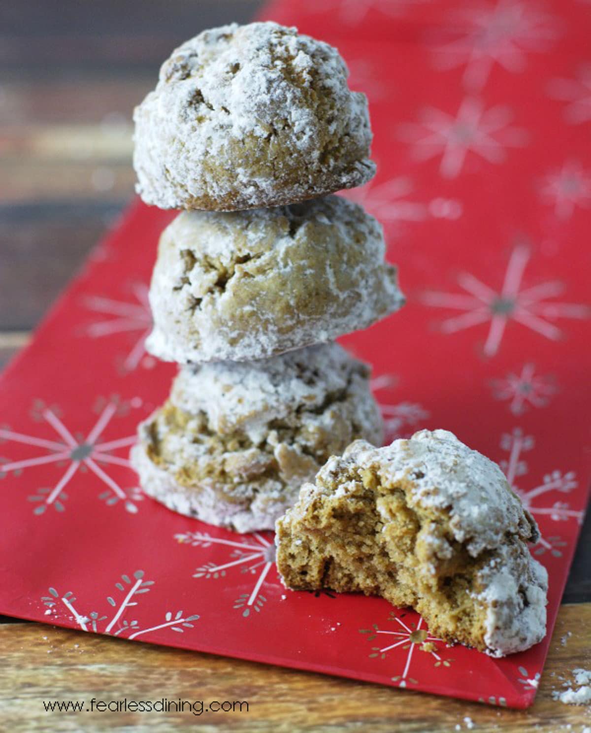 A stack of gluten free pfeffernusse cookies.