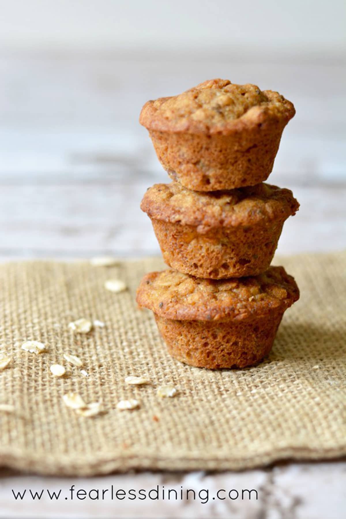 a stack of three banana oat muffins