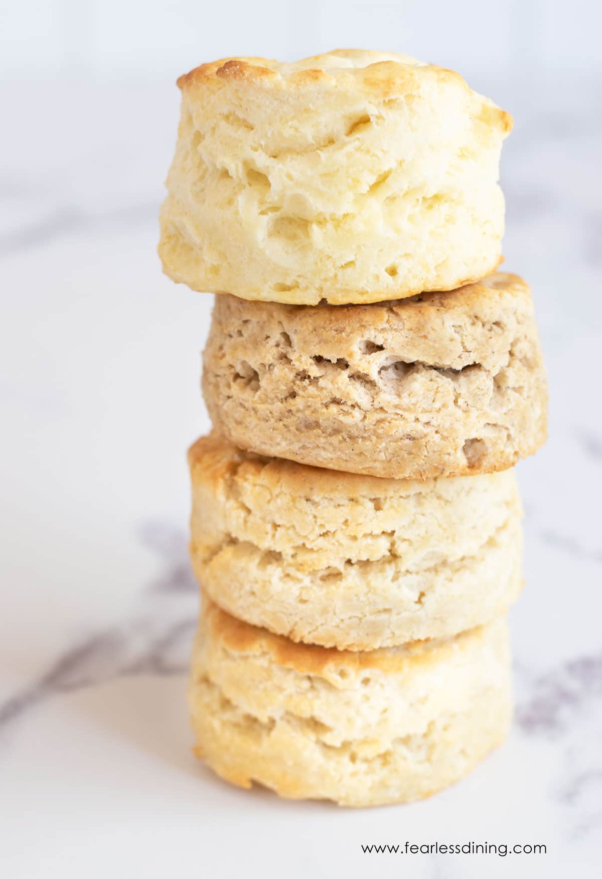 A stack of four gluten free biscuits.