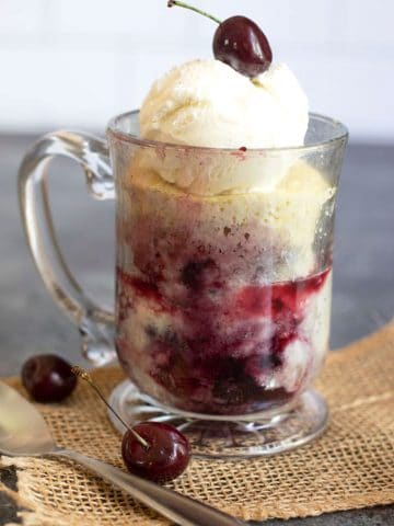 a cherry cobbler in a glass mug