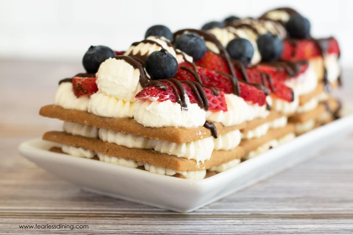 A red white and blue gluten free icebox cake on a plate.