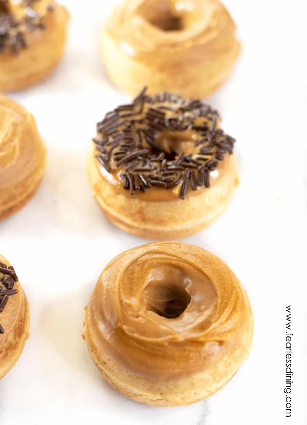 Two rows of peanut butter donuts.