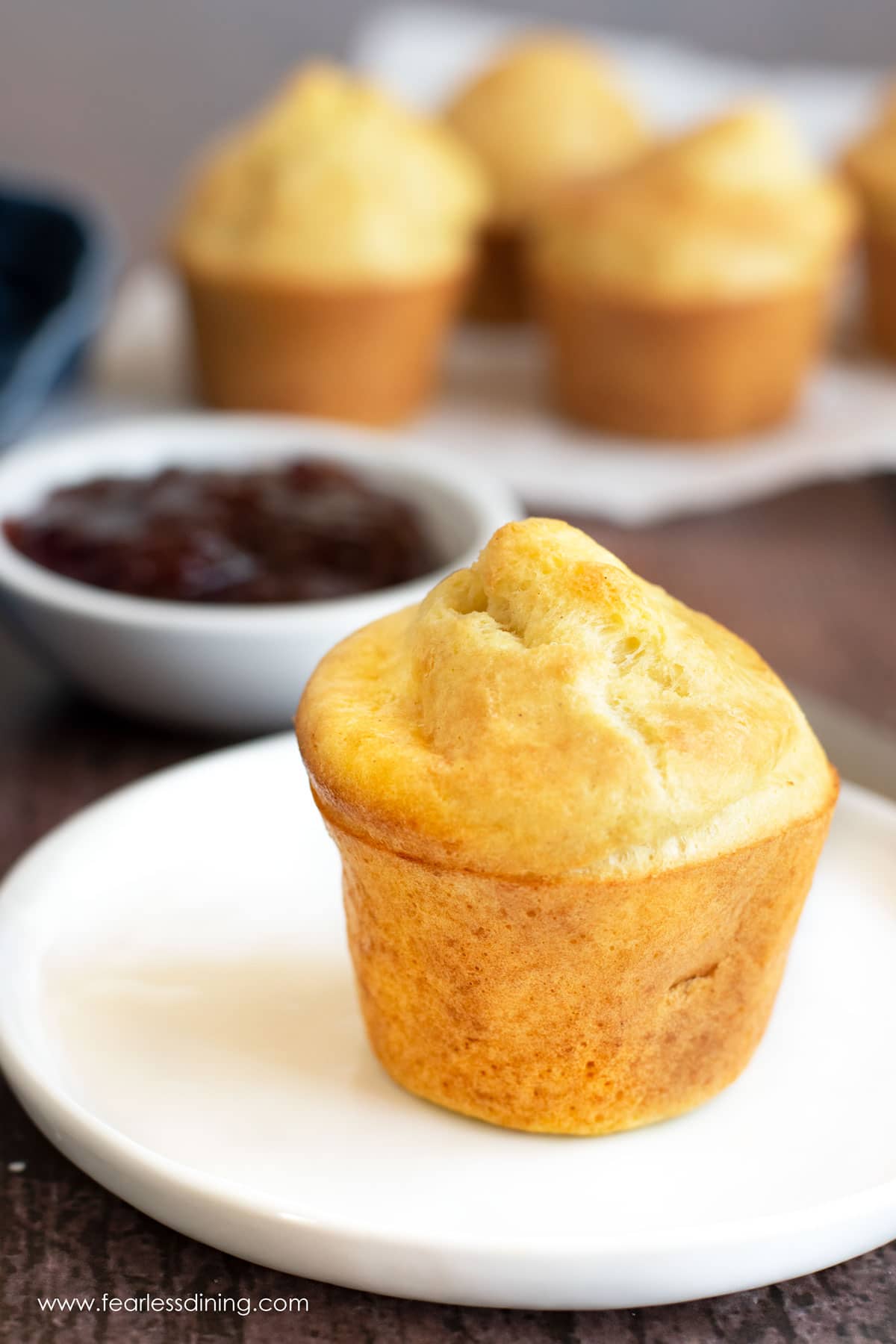 A single gluten free popover on a plate.