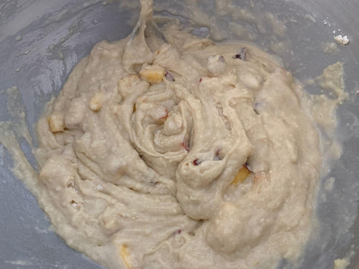 A photo of the peach muffin batter in a large bowl.