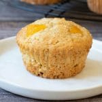 a pinterest image of peach muffins photos.