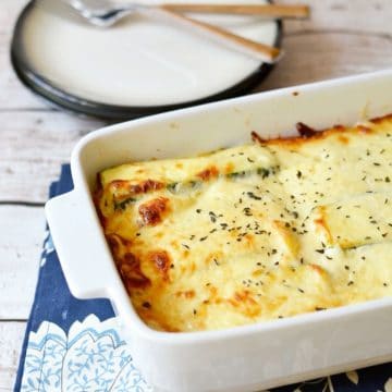 A baked lasagna alfredo on the dinner table.