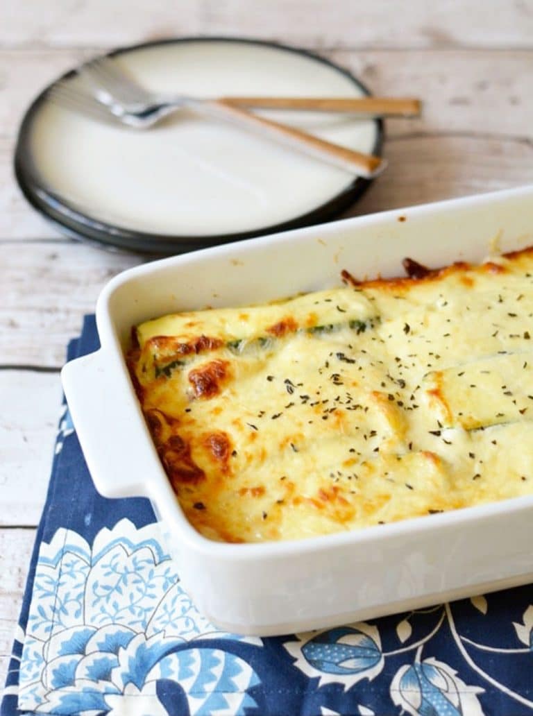 A baked lasagna alfredo on the dinner table.