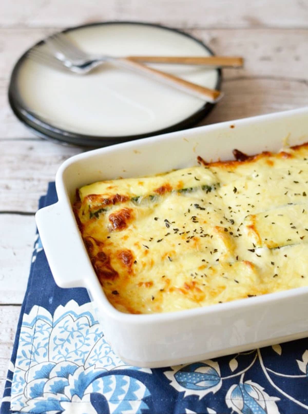 A photo of the alfredo zucchini casserole on a table.