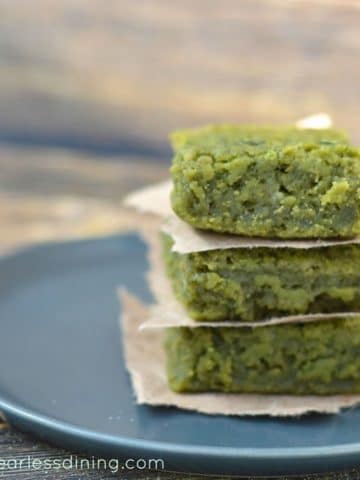 a stack of matcha mochi on a grey plate