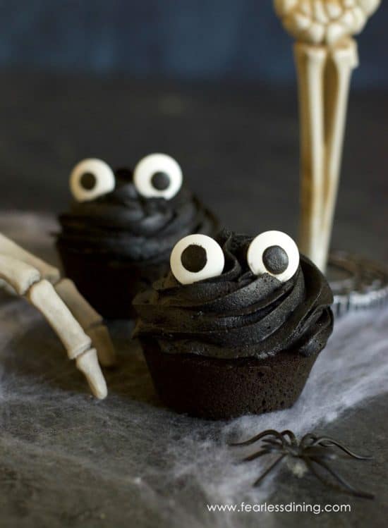 Black cupcakes with large googly eyes for Halloween.