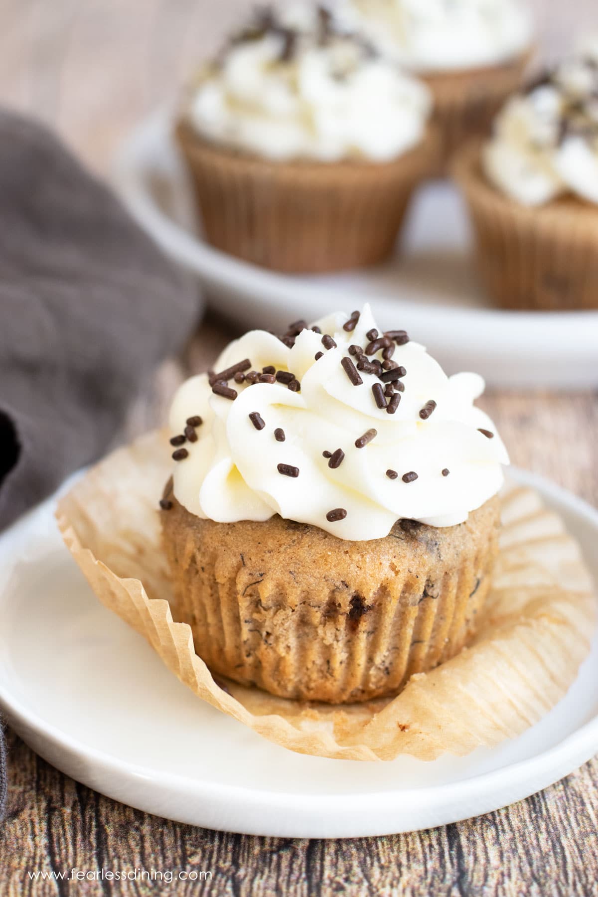 A banana cupcake on a plate.