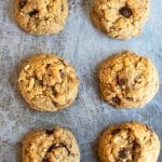 baked chocolate chip hazelnut cookies on a cookie sheet