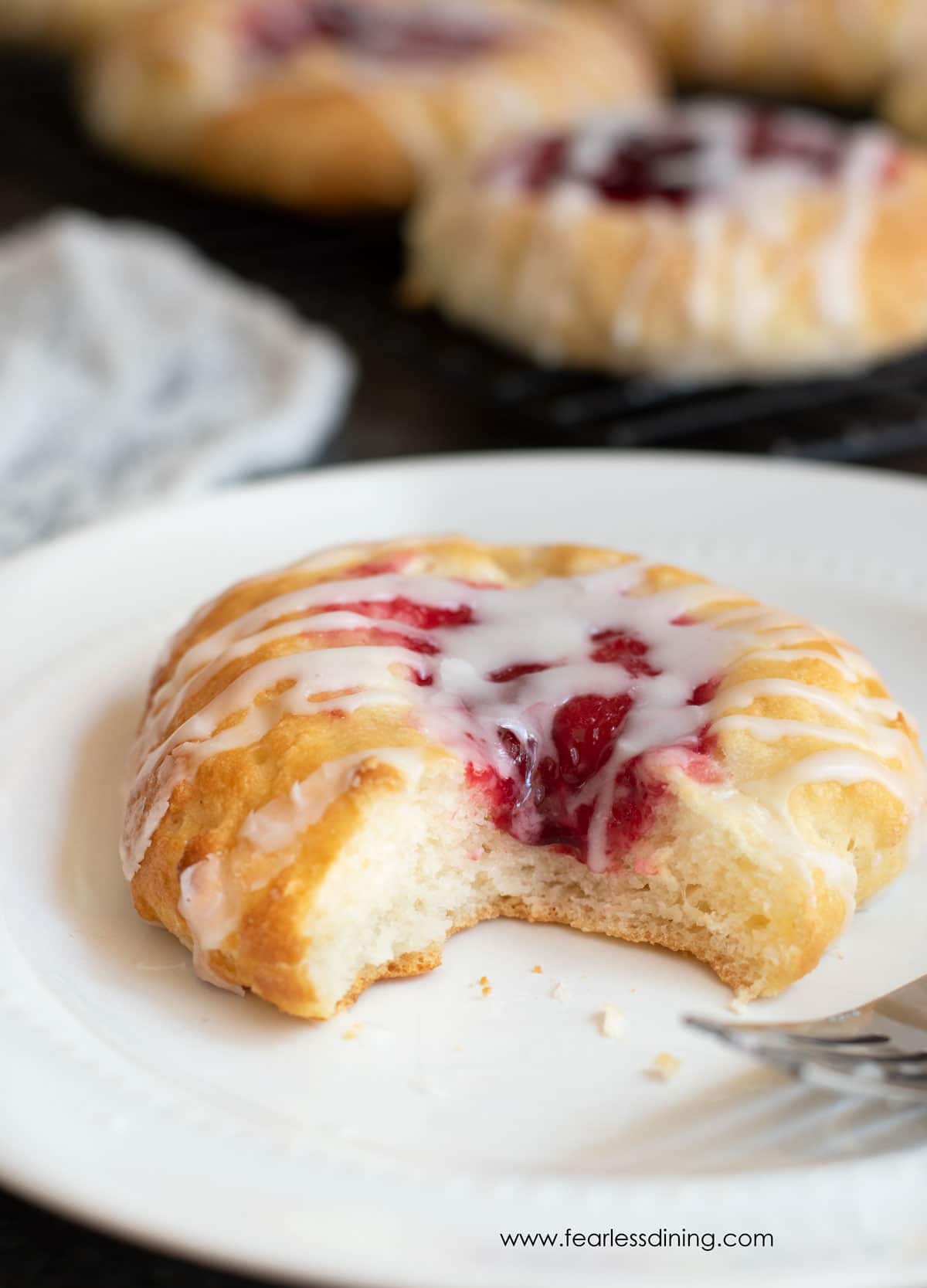 A gluten free kolache with a bite taken out.