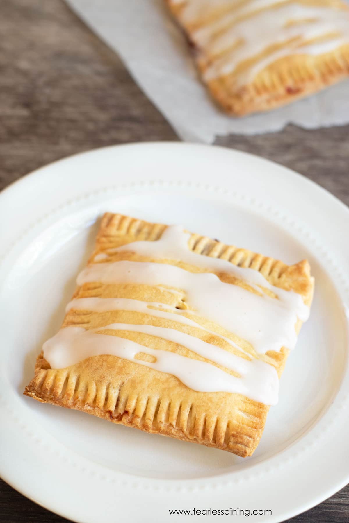 An iced pop tart on a plate.