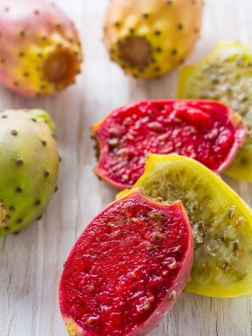 cut prickly pears on a cutting board