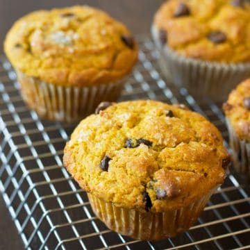 Pumpkin muffins cooling on a rack.