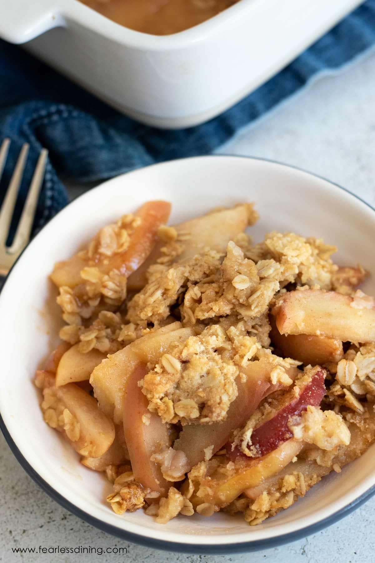 A bowl full of gluten free apple crisp.