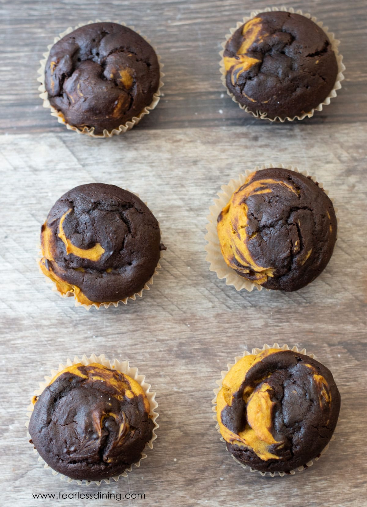 The top view of the pumpkin chocolate swirl muffins.