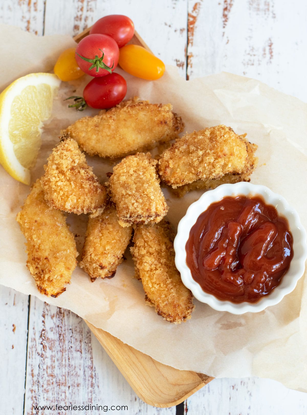 The top view of a tray of gluten free fish sticks.