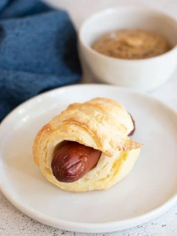 a gluten free pig in a blanket on a plate