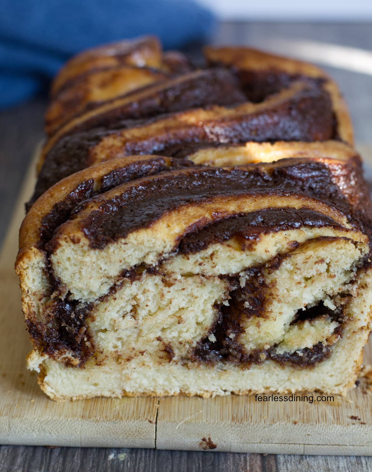 A sliced gluten free babka so you can see the chocolate swirls inside.