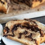 A slice of gluten free chocolate babka on a white plate.